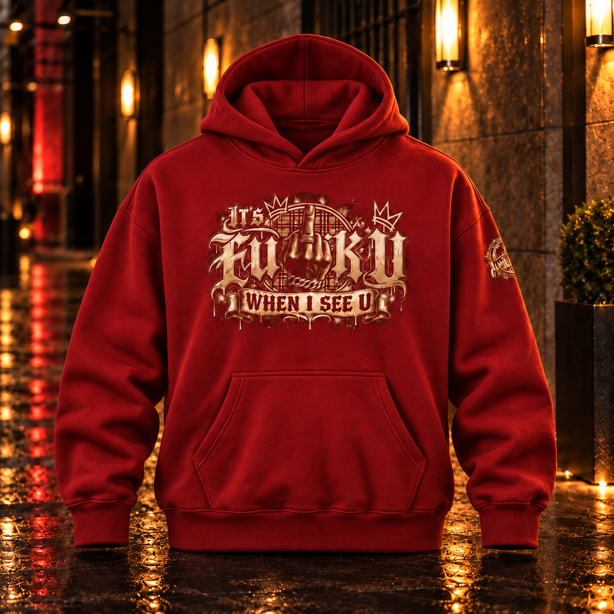 Front view of the Red Anyweather FUCK U WHEN I SEE U oversized fleece hoodie in a wet nighttime corridor