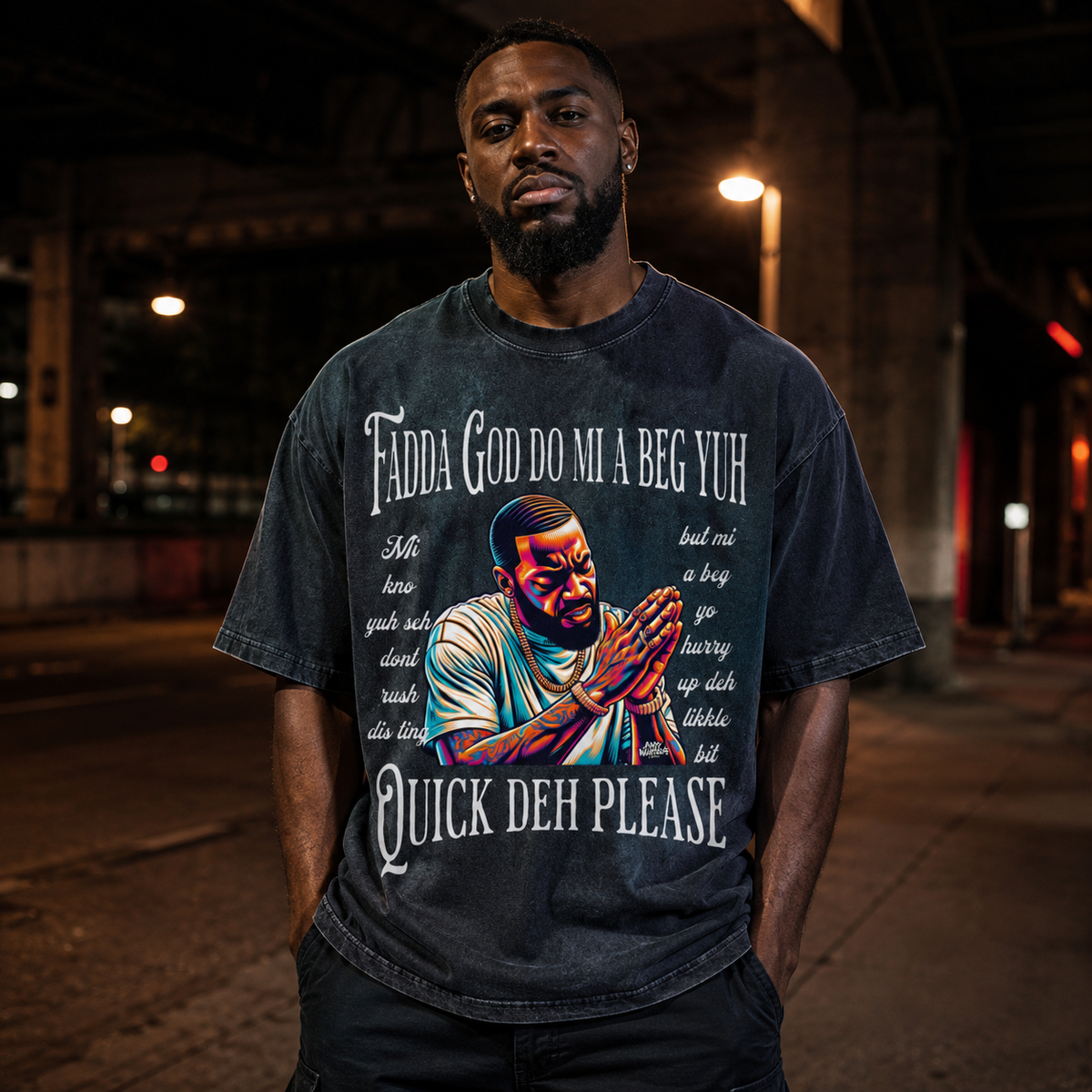 Male model front view wearing dark blue Fadda God Mi a Beg Yuh oversized T-shirt