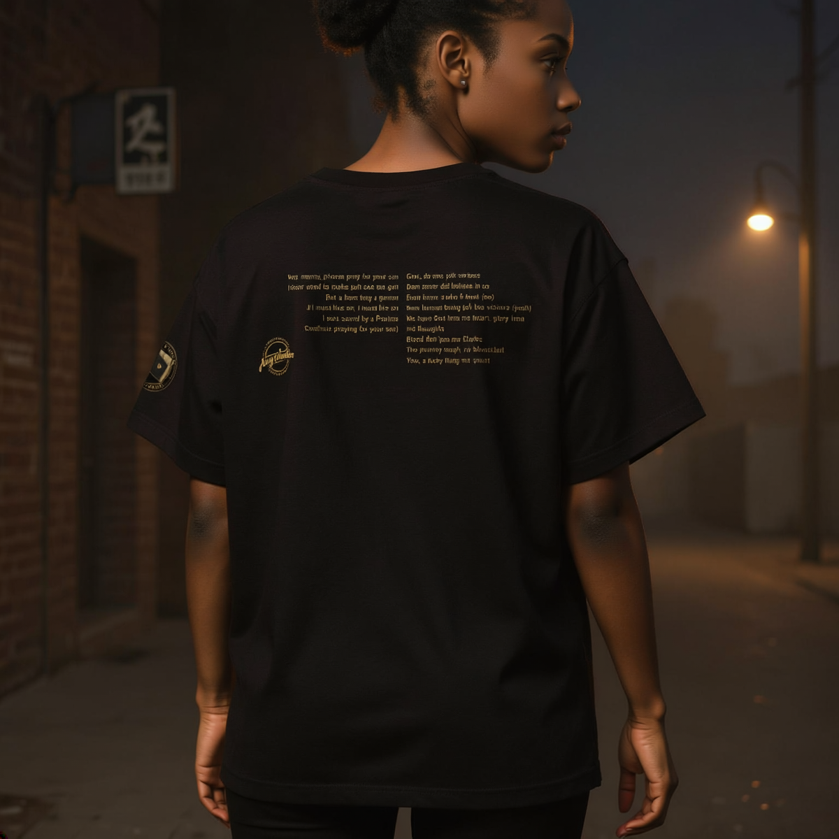 Female model wearing Black Unisex Tee in Classic Black — back