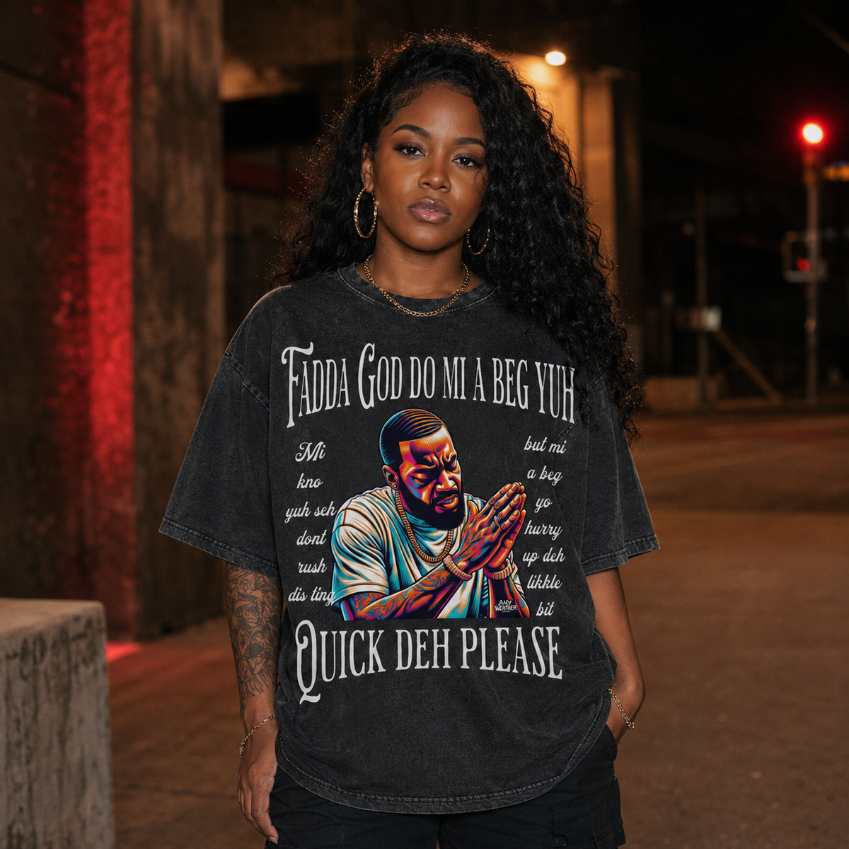 Female model front view wearing pirate gray Fadda God Mi a Beg Yuh oversized T-shirt